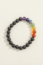 Multicolored beaded bracelet on a textured gray background