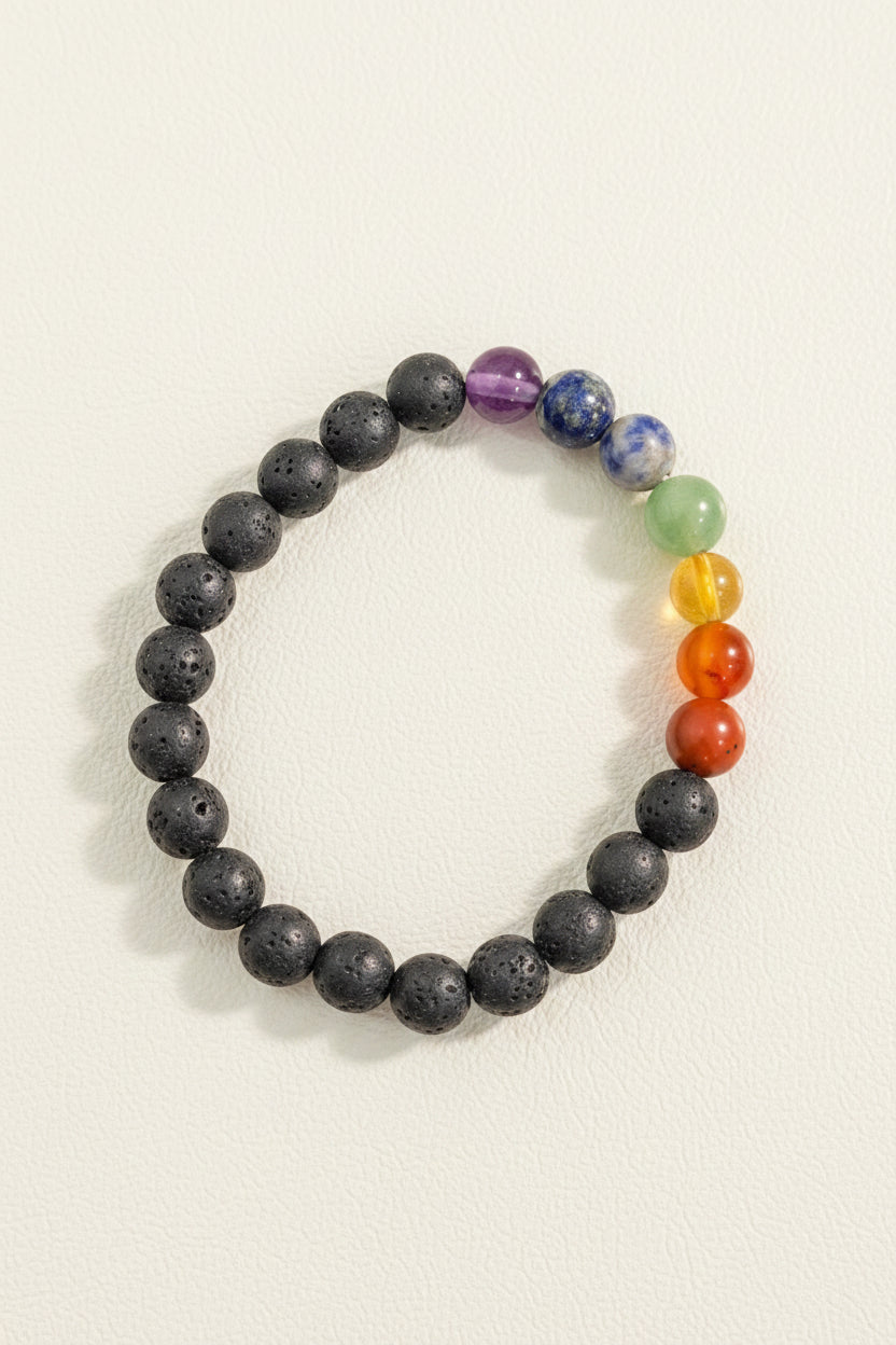Multicolored beaded bracelet on a textured gray background