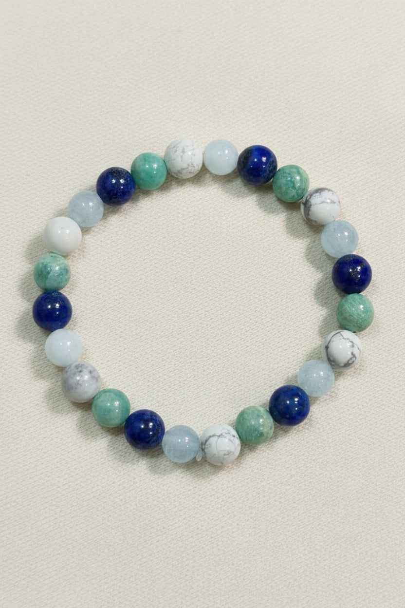 Multicolored beaded bracelet on a dark wooden surface